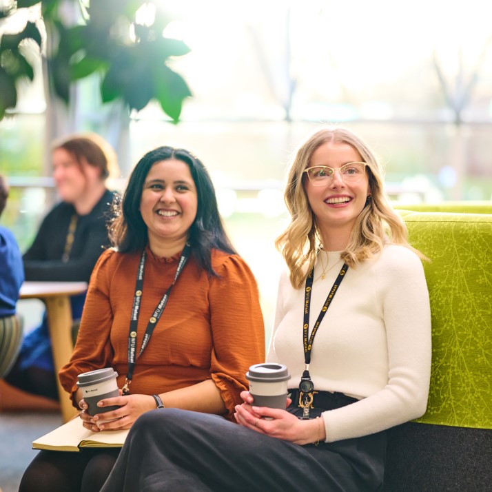 Two female colleagues smiling