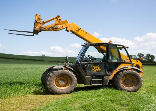 yellow-jcb-on-a-farm