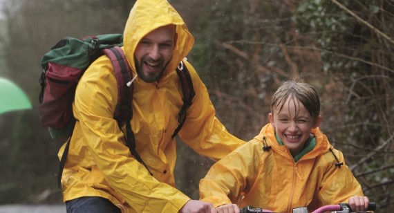 family-cycling-in-the -rain